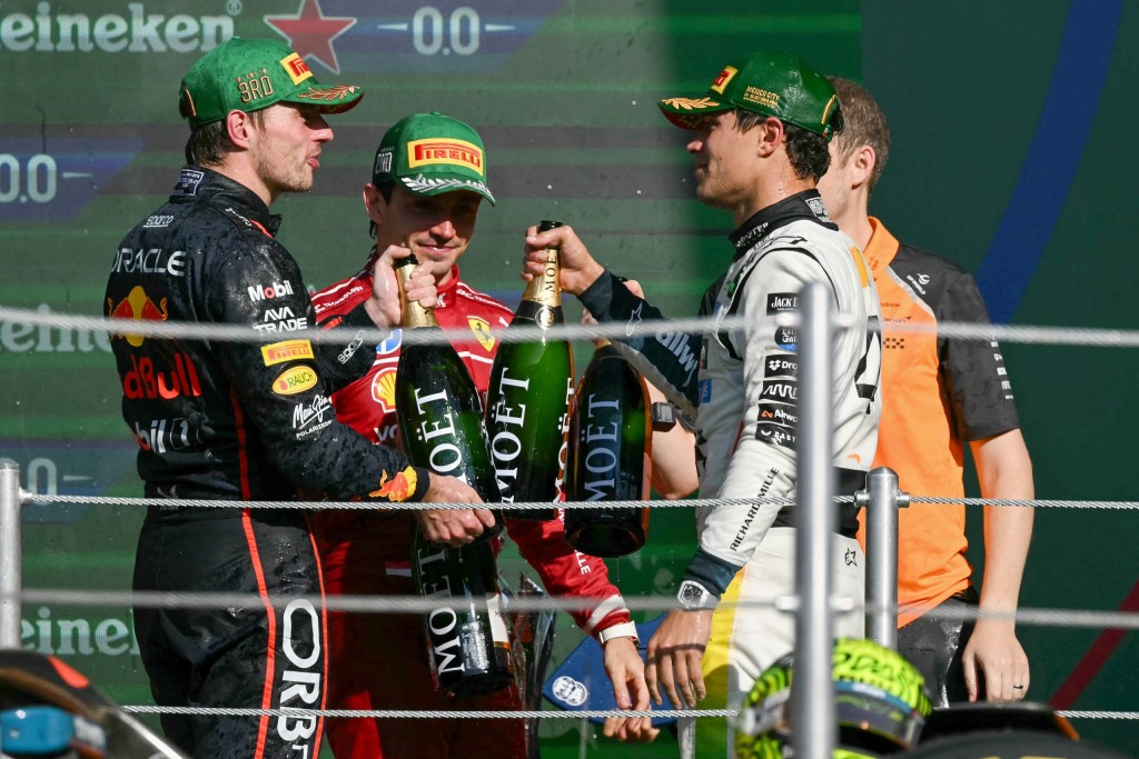Lando Norris, Charles Leclerc and Max Verstappen on the podium. Photo: Yuri Cortez/AFP