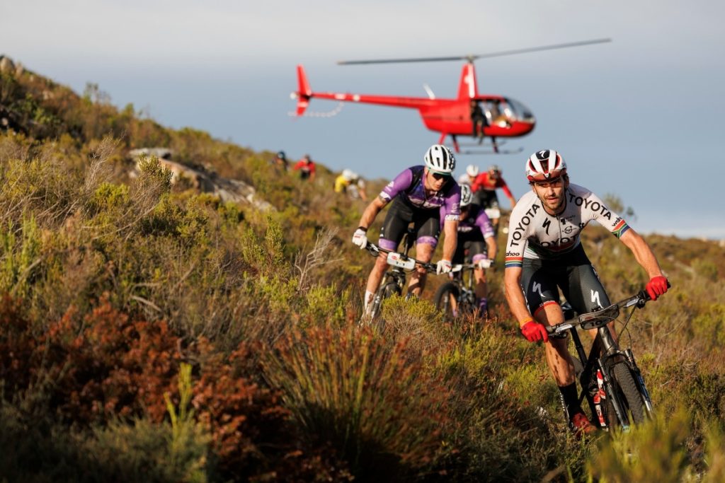 The cycling world’s attention turned to South Africa this week as organisers unveiled the 2026 Absa Cape Epic route, confirming another brutal test across 692 km of the Western Cape’s most unforgiving terrain. Set for March 15-22, the eight-day mountain bike stage race will challenge riders with 15,900 meters of climbing through some of the continent’s most spectacular and demanding landscapes.