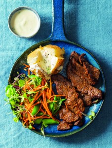 Air-fryer steak slices with baked potato and amasi sauce