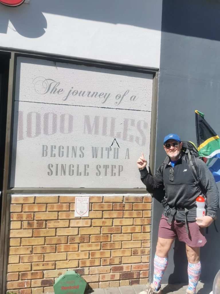Germishuys poses with motivational reminder during 1 600km charity walk from Johannesburg to Cape Town