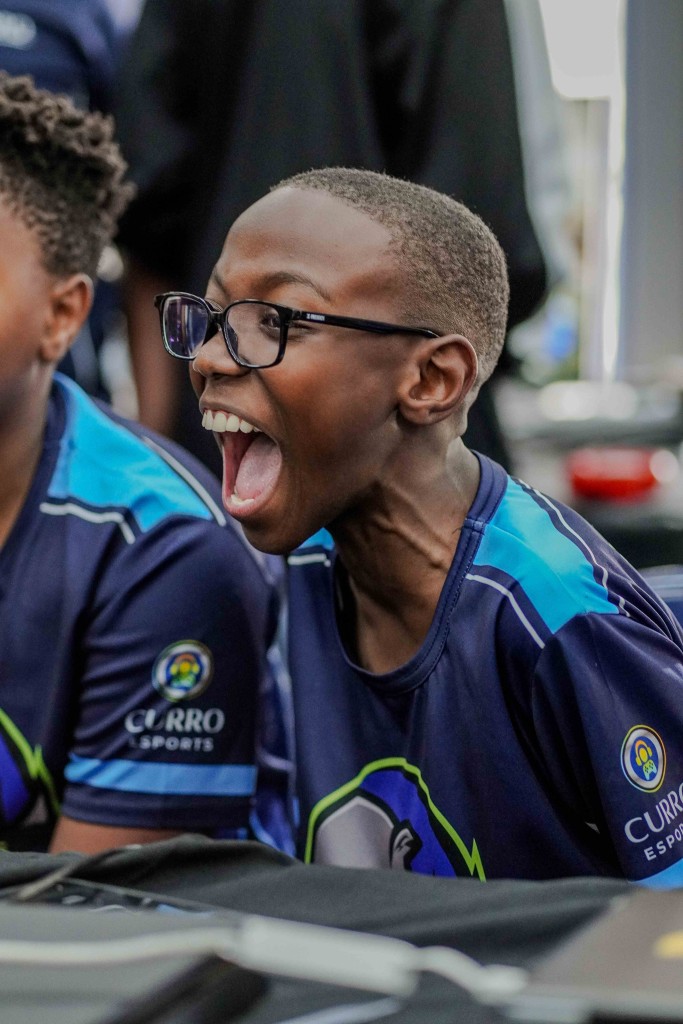 A jubilant Esports player celebrating a win.