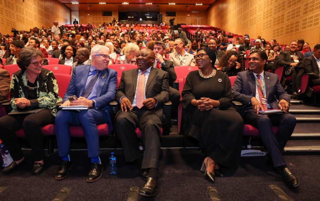 President Cyril Ramaphosa and some of the summit's speakers enjoying a chuckle as XXX addresses the President by his nickname, "Cupcake".
