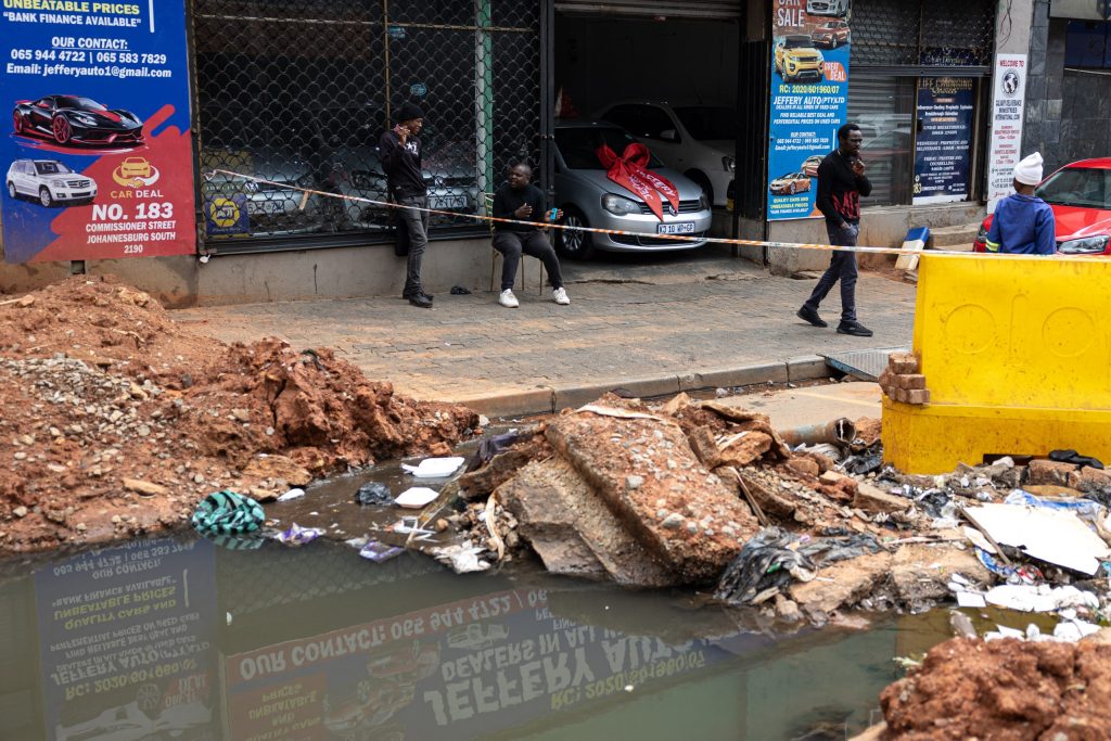 The sprawling metropolis of nearly six million people, home to Africa's richest square mile, has fallen into disrepair in recent years. Open sewers, potholed roads, and crowded shacks of corrugated iron line its fraying edges, prompting President Cyril Ramaphosa to call the city's condition "not pleasing."