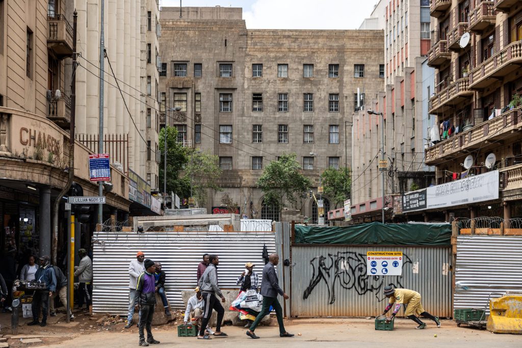 The sprawling metropolis of nearly six million people, home to Africa's richest square mile, has fallen into disrepair in recent years. Open sewers, potholed roads, and crowded shacks of corrugated iron line its fraying edges, prompting President Cyril Ramaphosa to call the city's condition "not pleasing."