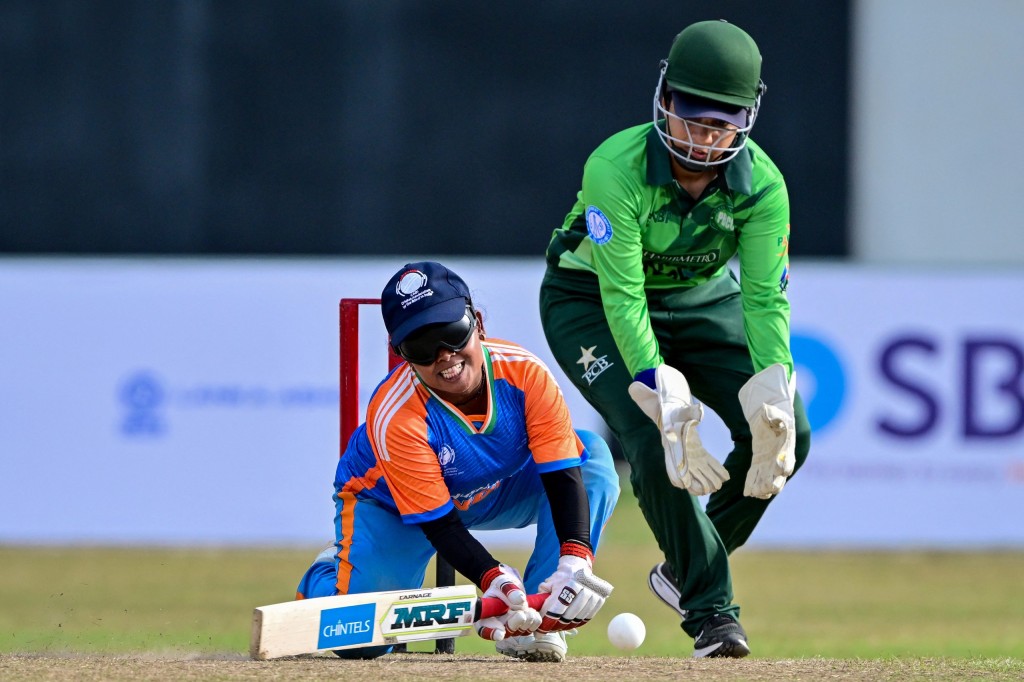India's Simu Das (L) plays a shot during the Women’s Blind Twenty20 World Cup 2025 match between India and Pakistan.
