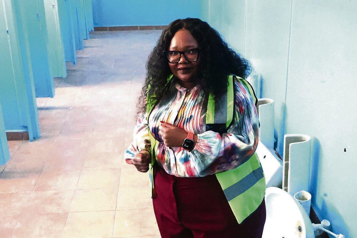 Siviwe Gwarube, Minister of Basic Education, inside a bathroom during her visit to Pellsrus Primary School.