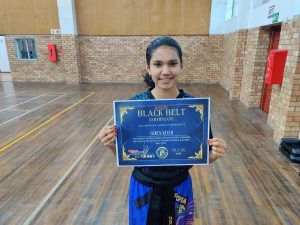 Youngest kickboxer awarded global black belt