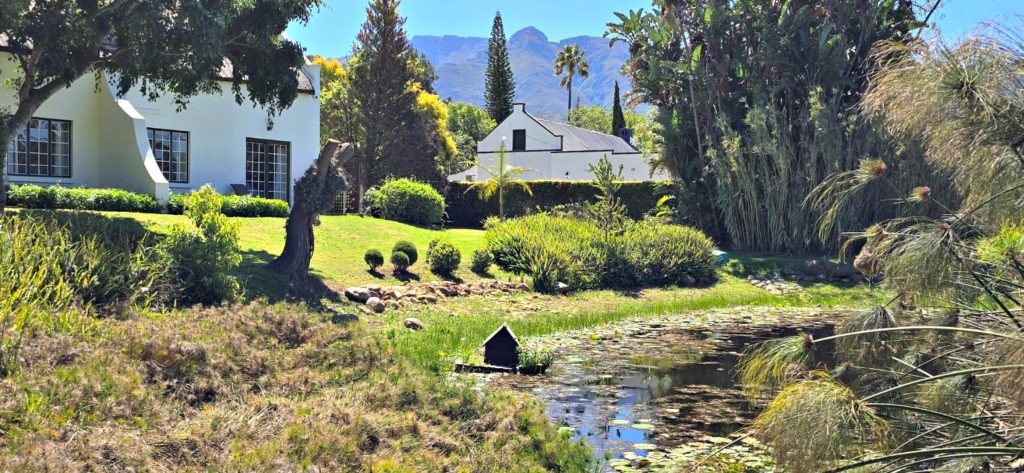 The thriving 5-star, luxury guest house, Rothman Manor Boutique Hotel, offering three historic thatched houses dating to around 1834 with six stylish guest suites and more on a 3.5ha estate is on the market for R12.8 million (Excl. VAT). Photo: Supplied