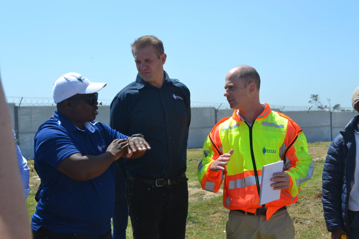Sello Seitlholo (Deputy Minister of Water and Sanitation), Reinhardt Foley (MMC for Civil and Water Services) and Jacques du Toit (Project Management Unit manager) standing alongside each other.