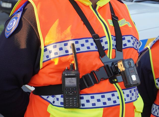 A Cape Town Metro Police officer’s reflective vest and radio, part of the city’s body worn and in-vehicle camera technology used for crime detection.