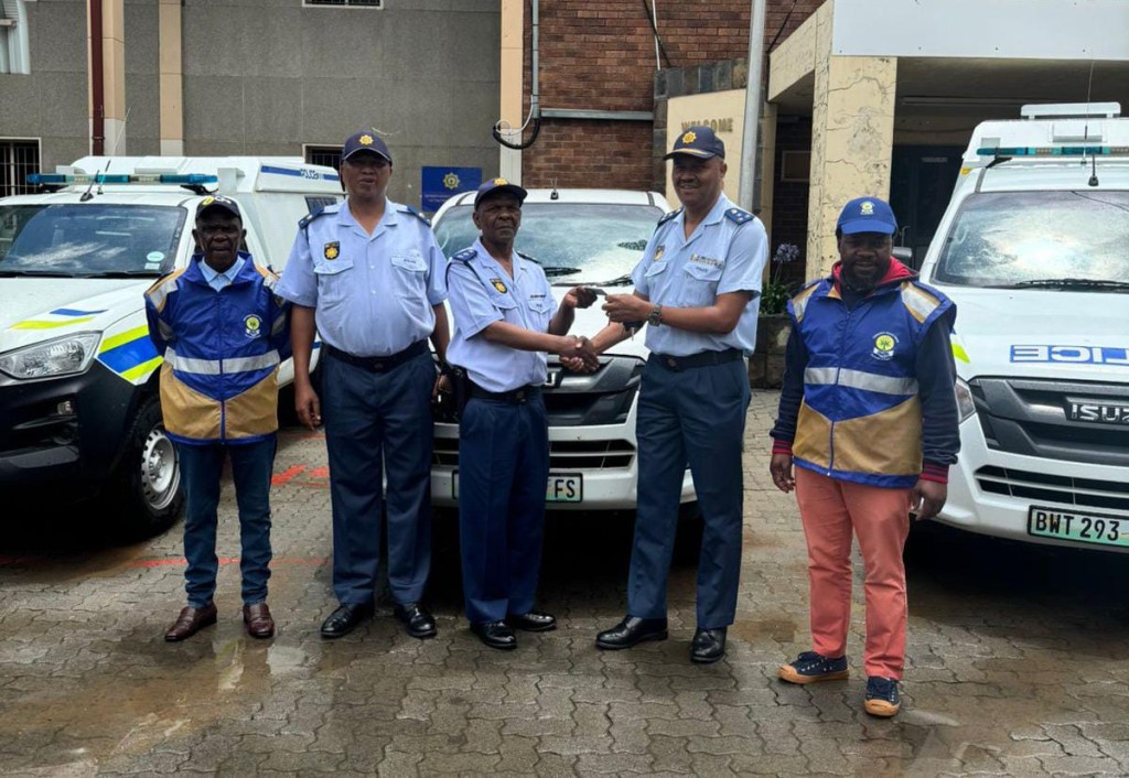 The new vehicles are expected to significantly improve response times and increase police presence in the community, particularly during the high-risk festive period when crime rates typically escalate. from the left are Ntsane Tsoaela (Thabong CPF chairperson), Lt Colonel Simon Ceba (Thabong SAPS Vispol commander), Capt. Stephen Gulling (shift commander), Brig. Envor Solomon (Thabong Staion commander) and Maboea Hanyane (Thabong CPF). 