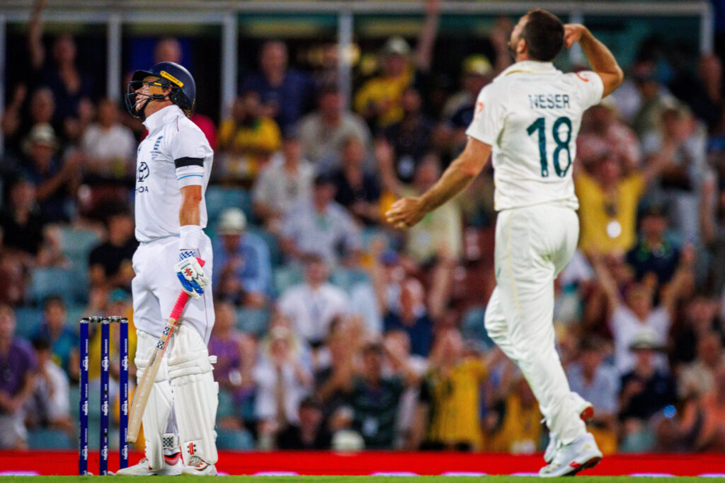 England's Ollie Pope is dismissed by Australia's Michael Neser on 6 December. PHOTO: Patrick HAMILTON / AFP
