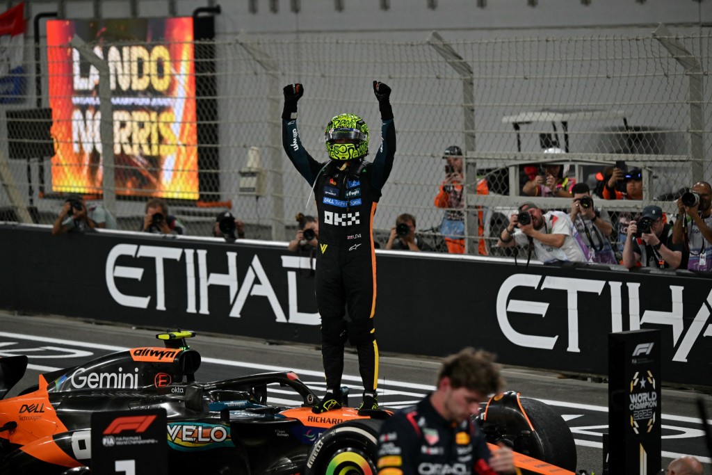 Lando Norris celebrates after winning his first Formula One World Championship.