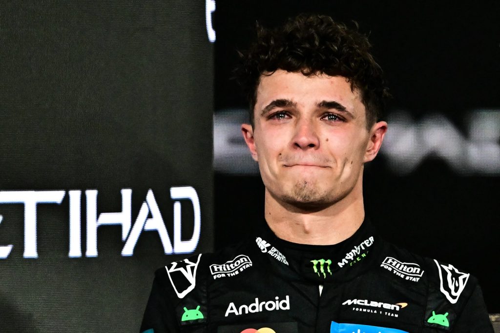 An emotional Lando Norris on the podium after clinching his first world title.