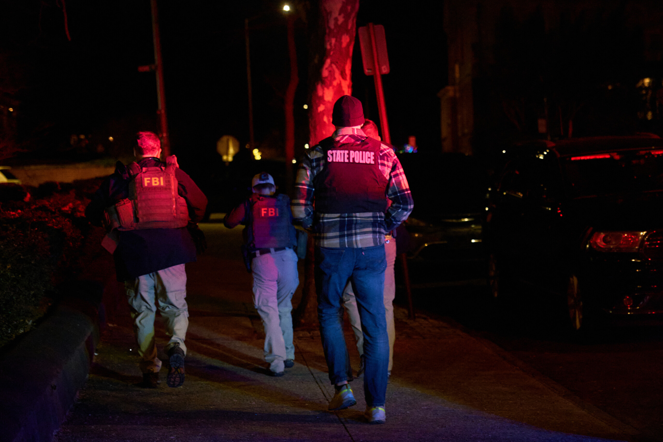 Police still hunt gunman who killed two, injured several, at Brown University