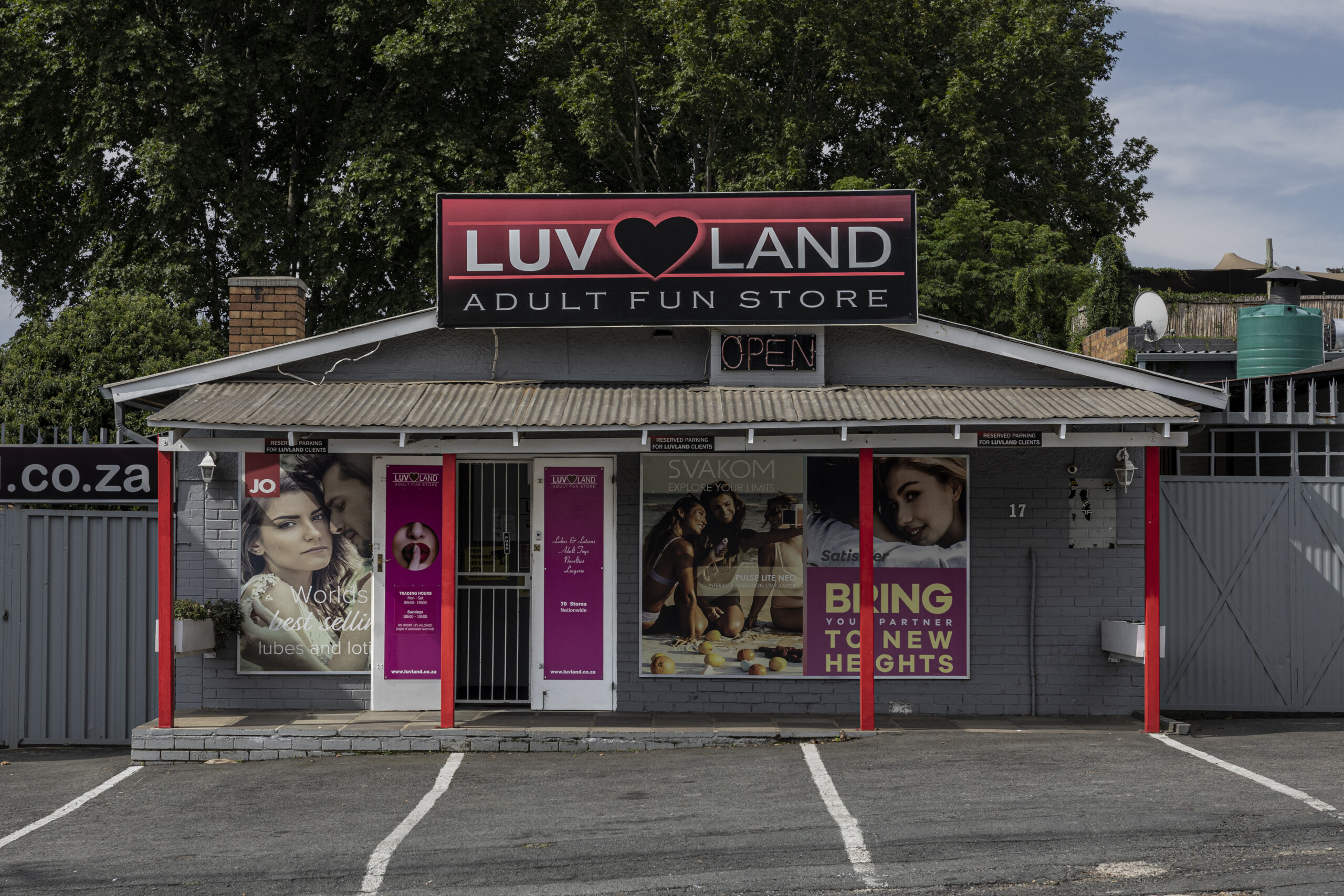 A provocative poster adorns lampposts throughout an affluent Johannesburg neighborhood: a finger pressed to crimson lips with the word "Luvland" split by a heart symbol. At the street corner stands one of the brand's 80 South African boutiques, representing a remarkable phenomenon on a continent where adult stores remain scarce or banned entirely.