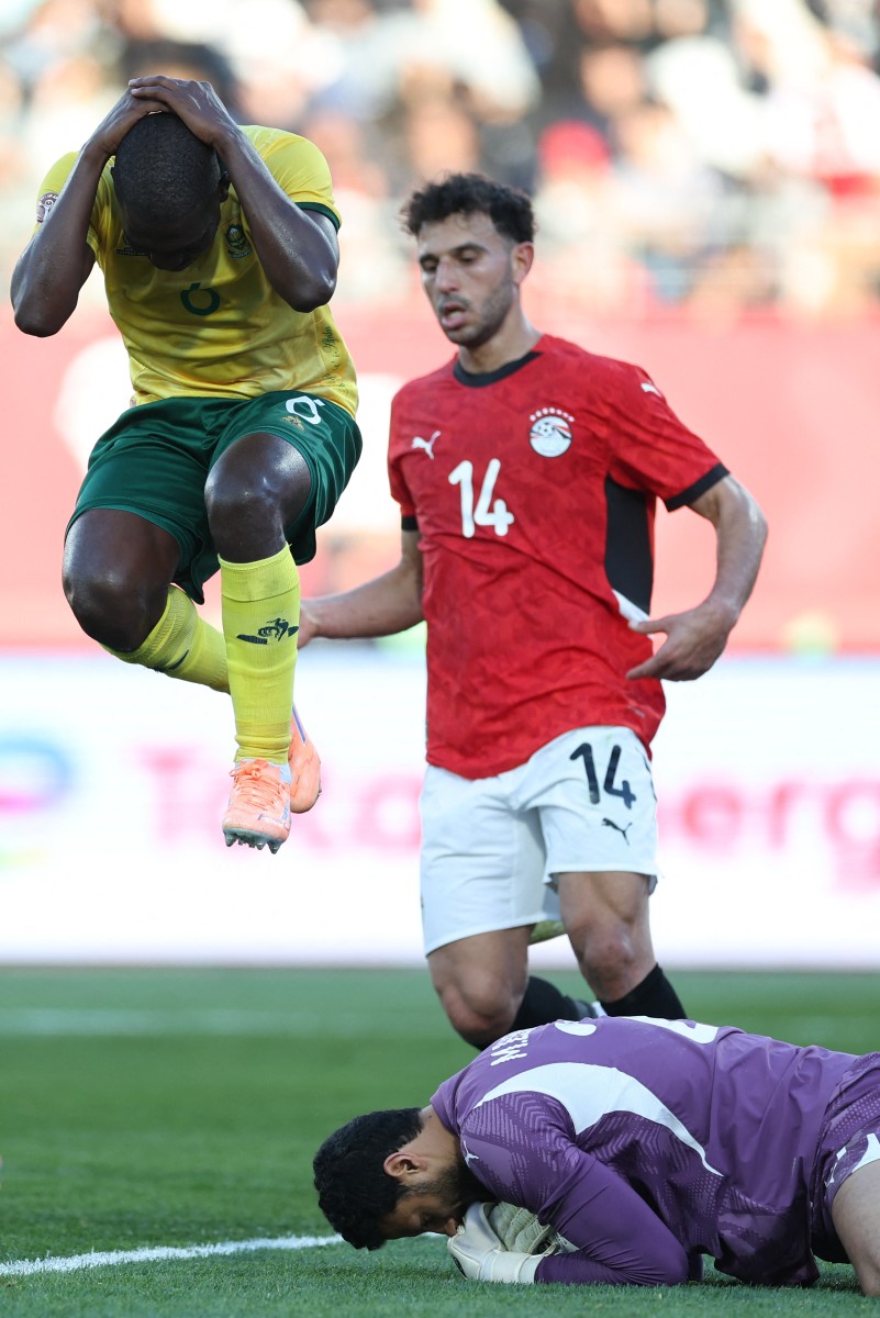 Egypt secured a crucial 1-0 victory over South Africa in their Group B Africa Cup of Nations encounter, with Mohamed Salah's first-half penalty proving decisive despite playing the entire second half with 10 men.