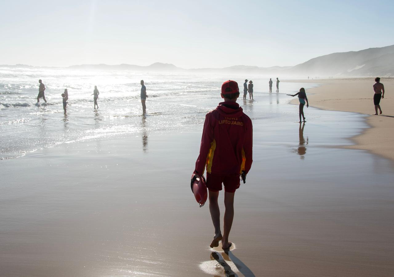 An NSRI lifeguard on the beach.