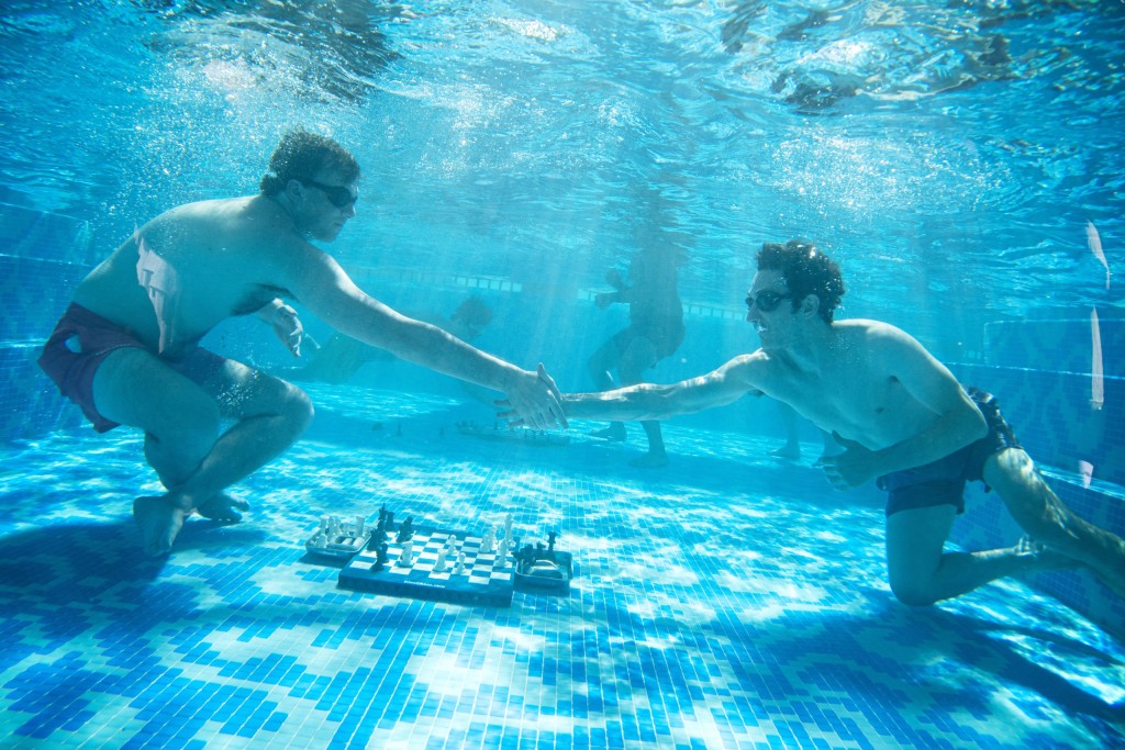 Fabiano Caruana (USA) congratulates fellow American Hans Niemann on his victory in the Diving Chess final.