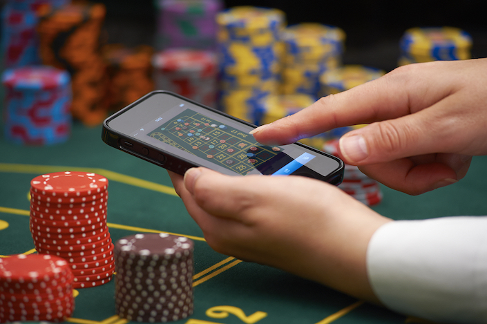 South Africa’s National Treasury has proposed implementing a 20% tax on online gambling revenue as the country grapples with a surge in digital betting that has reached alarming proportions, driven by economic desperation and widespread smartphone usage.

The proposed levy, outlined in a Treasury discussion paper released recently, could generate approximately R10 billion in additional government revenue. However, officials stated that the tax’s primary objective extends far beyond revenue collection.