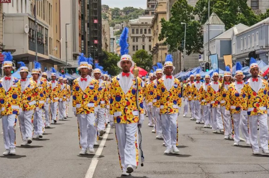  For 77-year-old Fatima Dulvie, the annual minstrel parade represents more than just a colorful spectacle — it's a living connection to her childhood in Cape Town's demolished District Six and a proud assertion of her community's unique cultural identity.