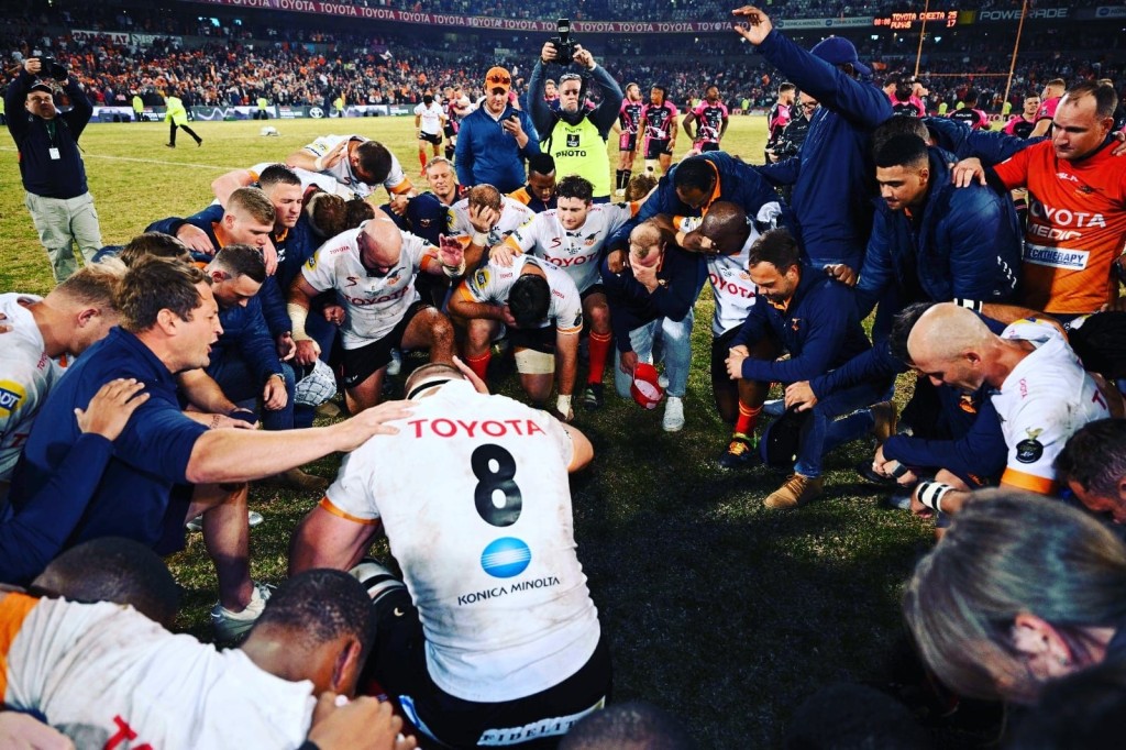 Schalk Ferreira praying with the Cheetahs after a match.