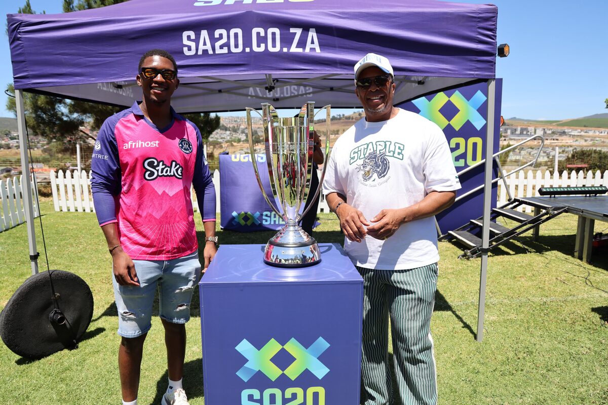 Paarl Royals player Nqaba Peter and former Protea paceman Makhaya Ntini with the coveted SA20 trophy.