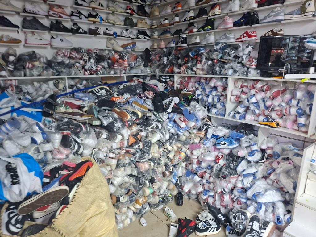 Among the confiscated goods were high-end designer branded footwear. Photo: SAPS, Facebook