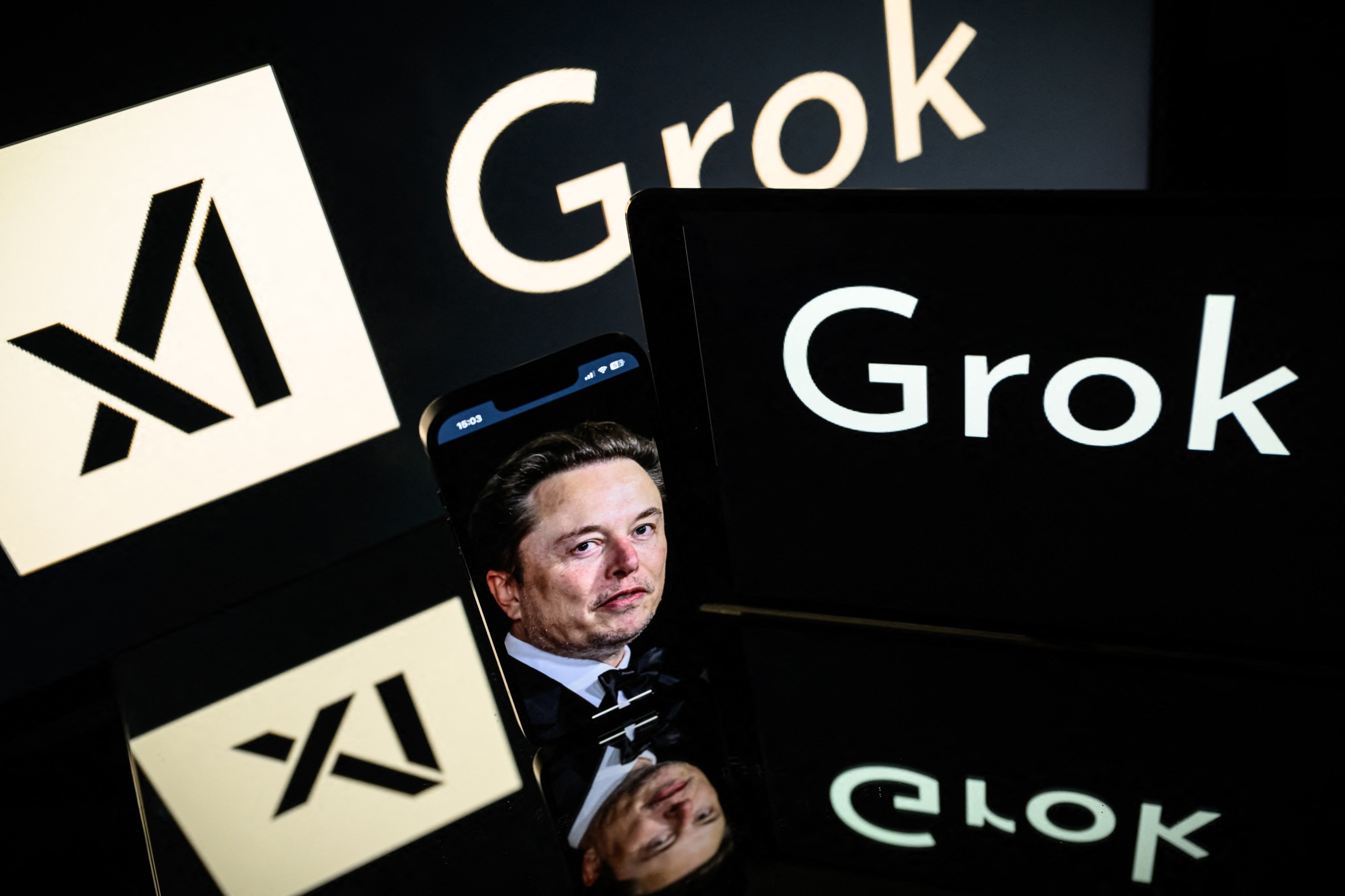 Screens display the logo of Grok and xAI founder Elon Musk, as seen in Toulouse in January last year. Photo: Lionel Bonaventure / AFP
