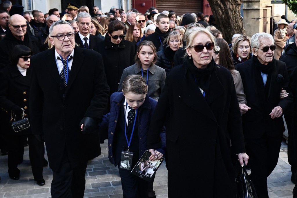 Brigitte Bardot's son Nicolas-Jacques Charrier (left) walks in the cortege behind the hearst.