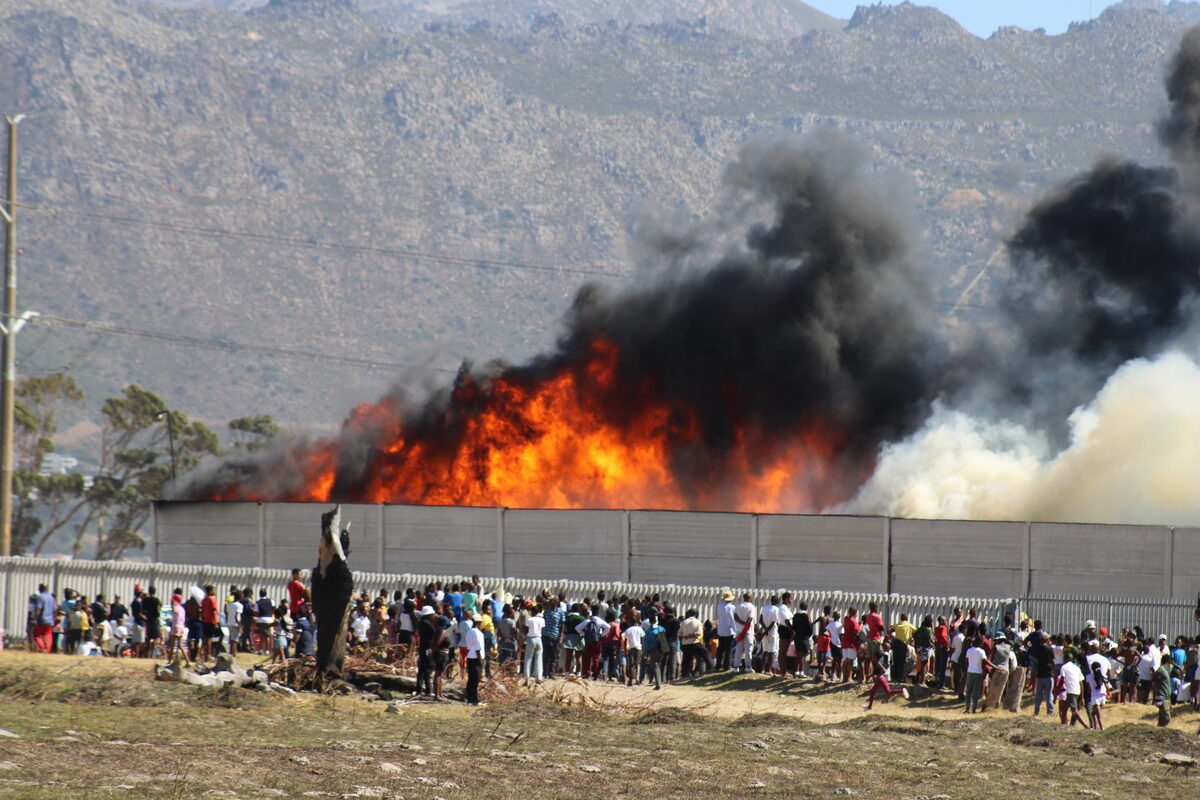 Large flames spewed massive columns of black smoke from the Broadlands Road industrial area.