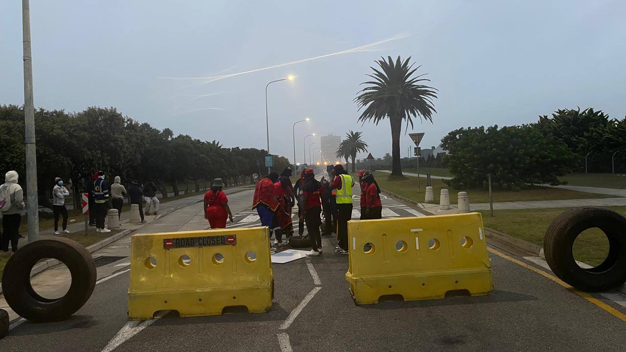 Road closure sign visible during Nelson Mandela Bay University student protests on February 12, 2026, as demonstrators blocked access to campus facilities.