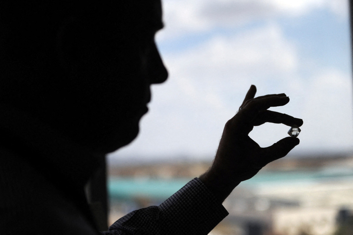 A clerk of mining giant De Beers grades diamonds from Botswana at the De Beers office on 3 October 2016 in Gaborone.