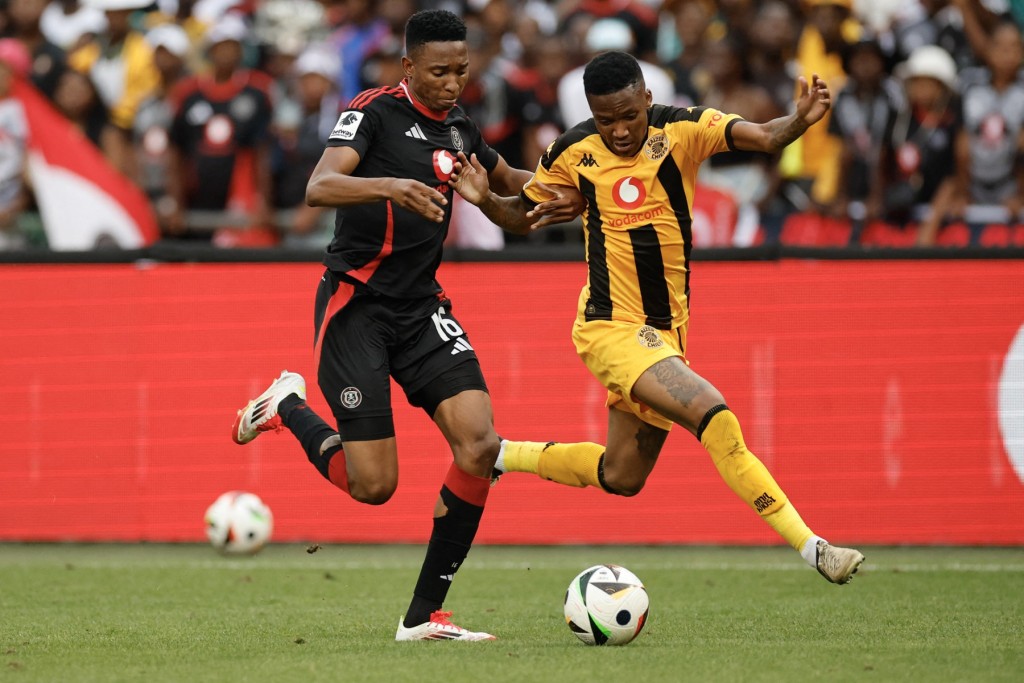 Thalente Mbatha fights for the ball with Pule Mmodi in the PSL football match between Orlando Pirates and Kaizer Chiefs.