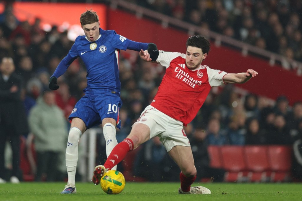 Cole Palmer vies with Arsenal's Declan Rice during the English League Cup semi final second leg, 