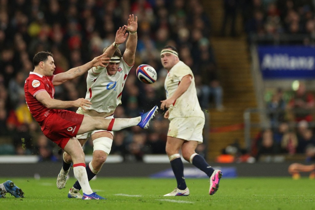 Guy Pepper blocks a shot from Wales' scrum-half Tomos Williams. England thrashed Wales 48-7.