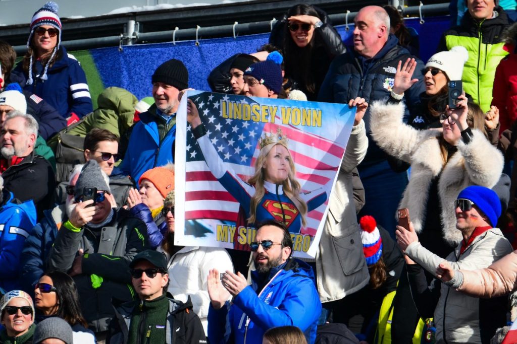 Spectators hold up a banner depicting US' Lindsey Vonn at the women's downhill event.