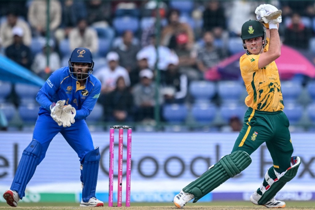 South Africa's Dewald Brevis (R) plays a shot during the 2026 ICC Men's T20 Cricket World Cup group stage match