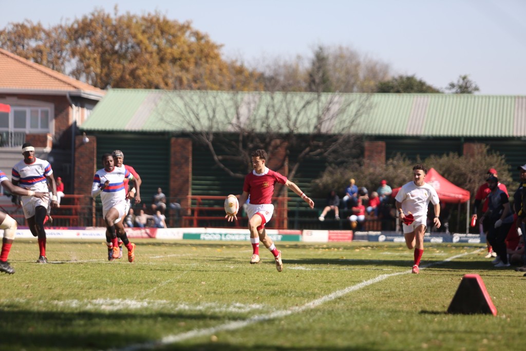 KES player kicking the ball forward during a match.