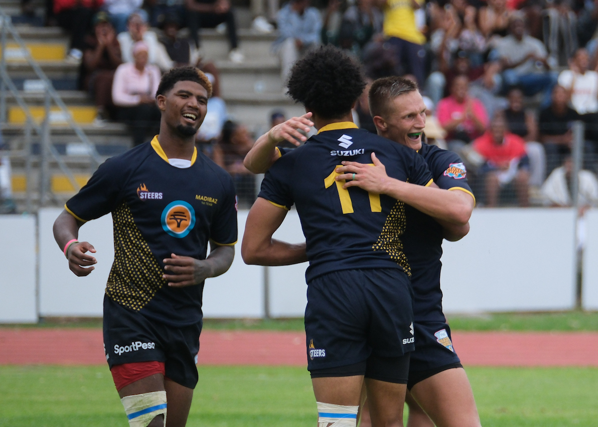 Jaden Witbooi of Madibaz scores a try and celebrates during the Varsity Shield rugby match between the Madibaz and UKZN