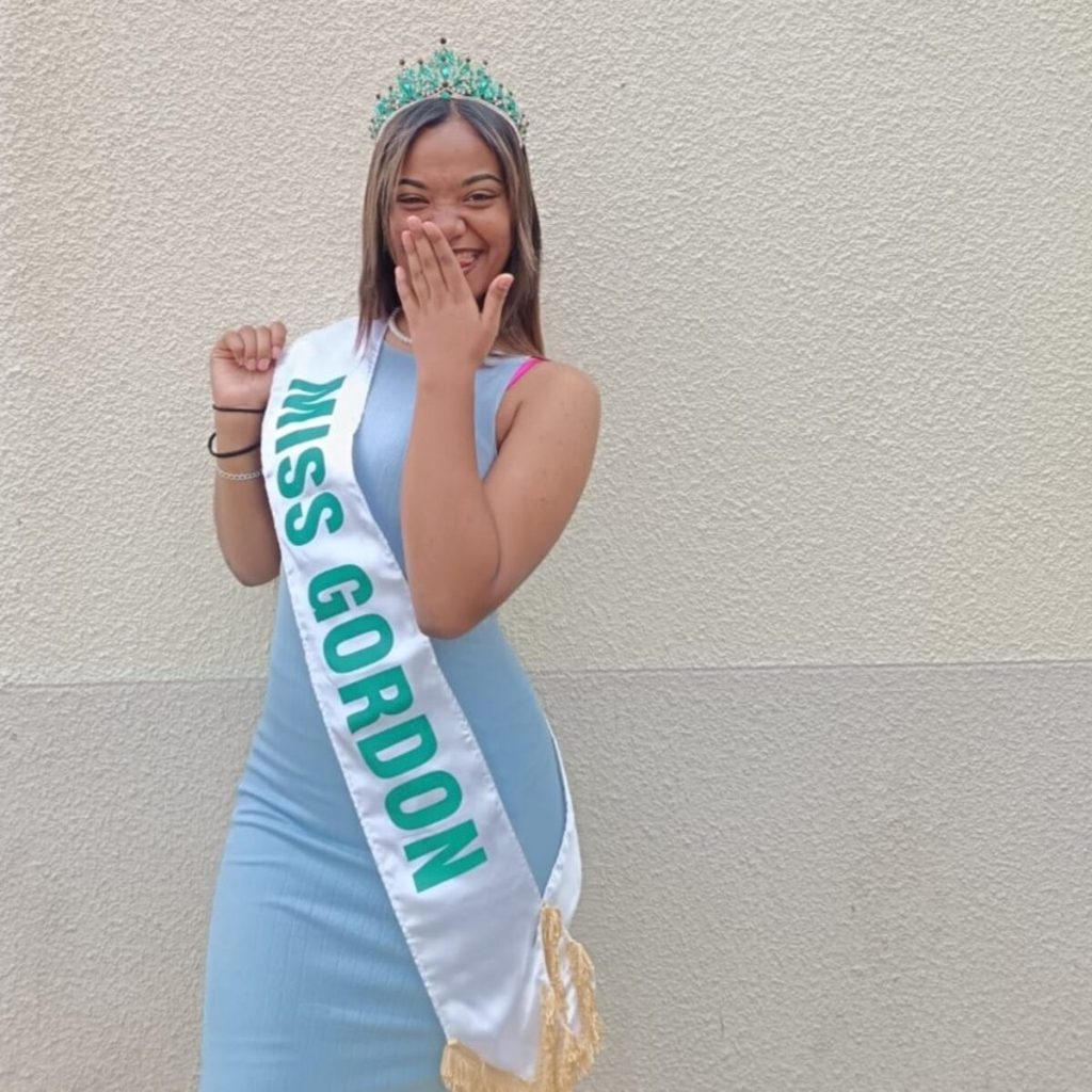 Hannah Banien wearing a crown and sash, smiling while celebrating her Miss Gordon 2023 victory.