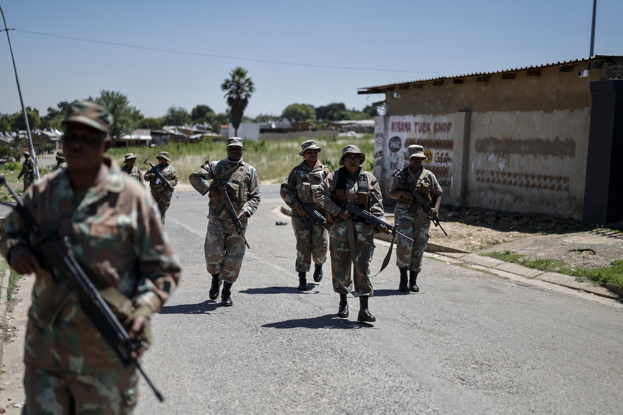 Soldiers patrol township streets near Johannesburg.