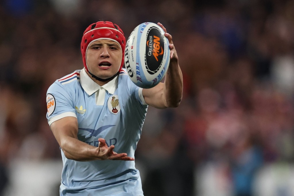 France's wing Louis Bielle-Biarrey catches the ball during of the Six Nations international rugby union match between France and England.