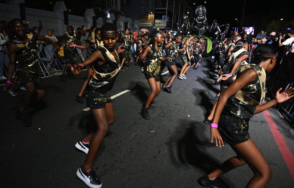 Photo of people dancing in the Cape Town Carnival parade.