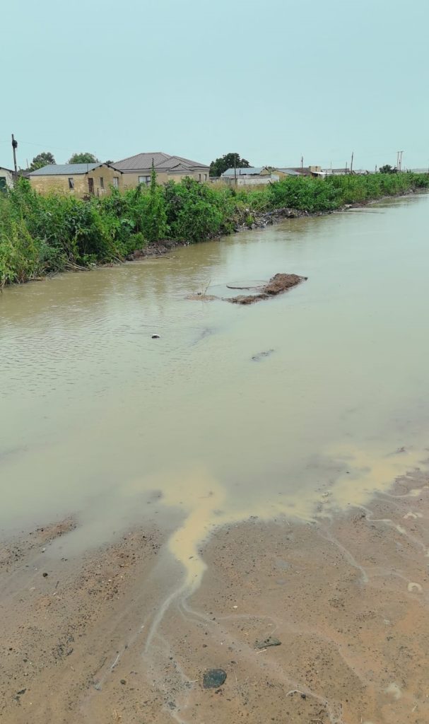 Floodwater entered homes, roads became impassable, and emergency services and water-delivery vehicles were unable to reach residents.