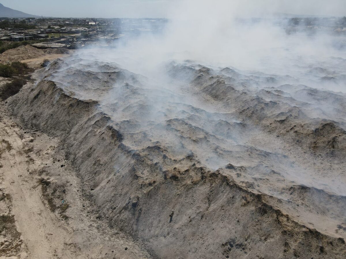 Smoke from the smouldering heap has reach suburbs up to 20km away.