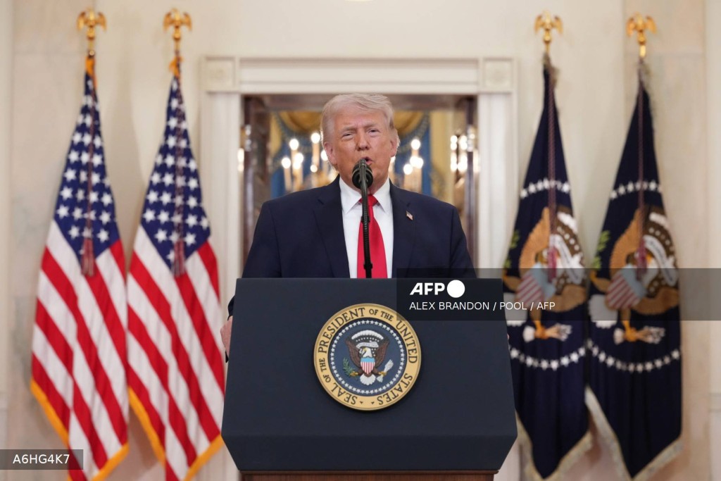 US President Donald Trump speaks during a televised address on the conflict in the Middle East from the Cross Hall of the White House in Washington, DC on April 1, 2026.
