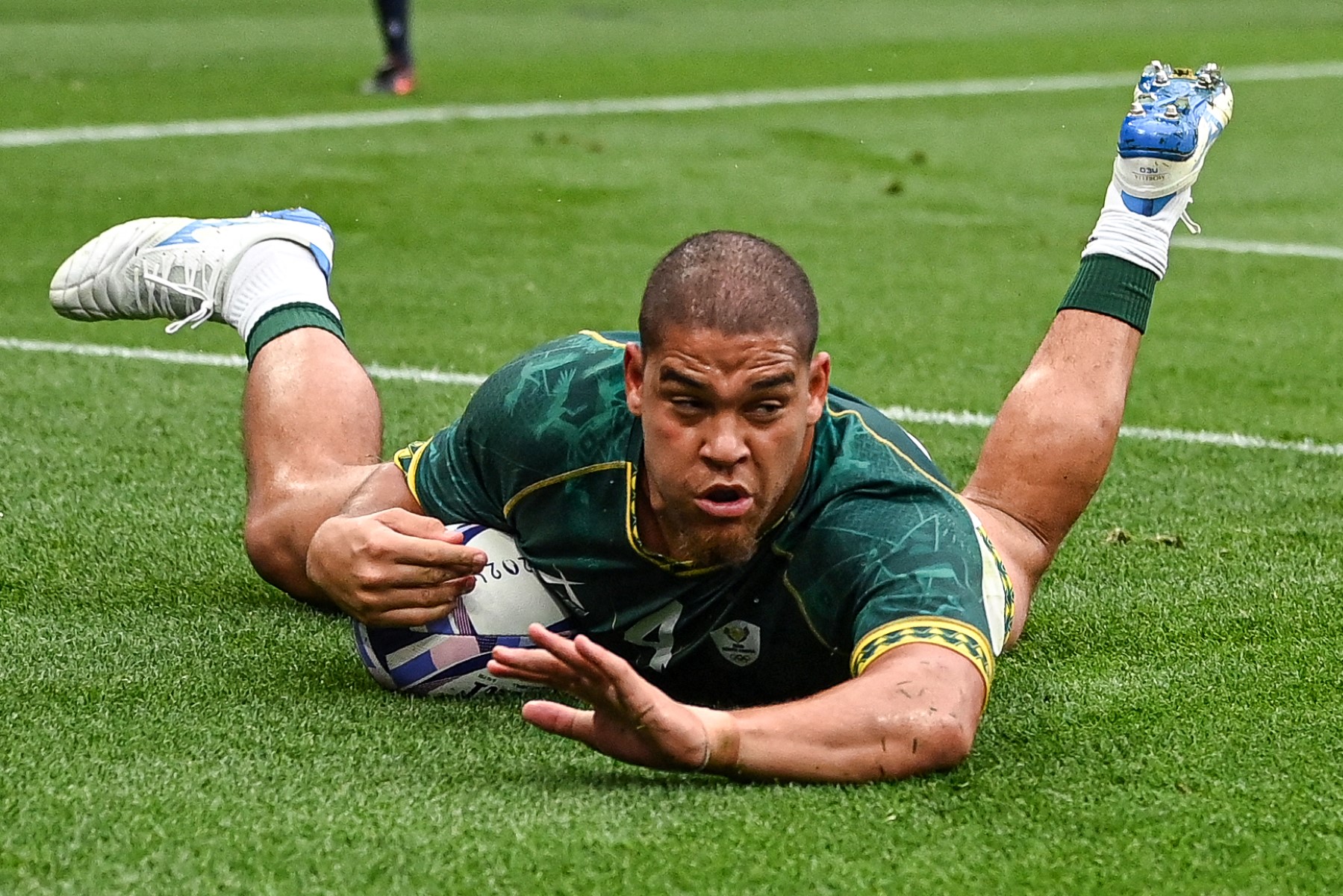 South Africa's Zain Davids scores a try during the men's bronze medal rugby sevens match between South Africa and Australia during the Paris 2024 Olympic Games