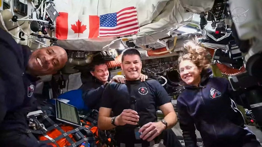 This screengrab taken from a NASA livestream shows Artemis II mission astronauts (L-R) NASA's pilot Victor Glover, NASA's commander Reid Wiseman, Canadian Space Agency's mission specialist Jeremy Hansen and NASA's mission specialist Christina Koch as they attend a "VIP call" with Canadian children from inside the Orion spacecraft while on their way to the Moon on April 4, 2026.