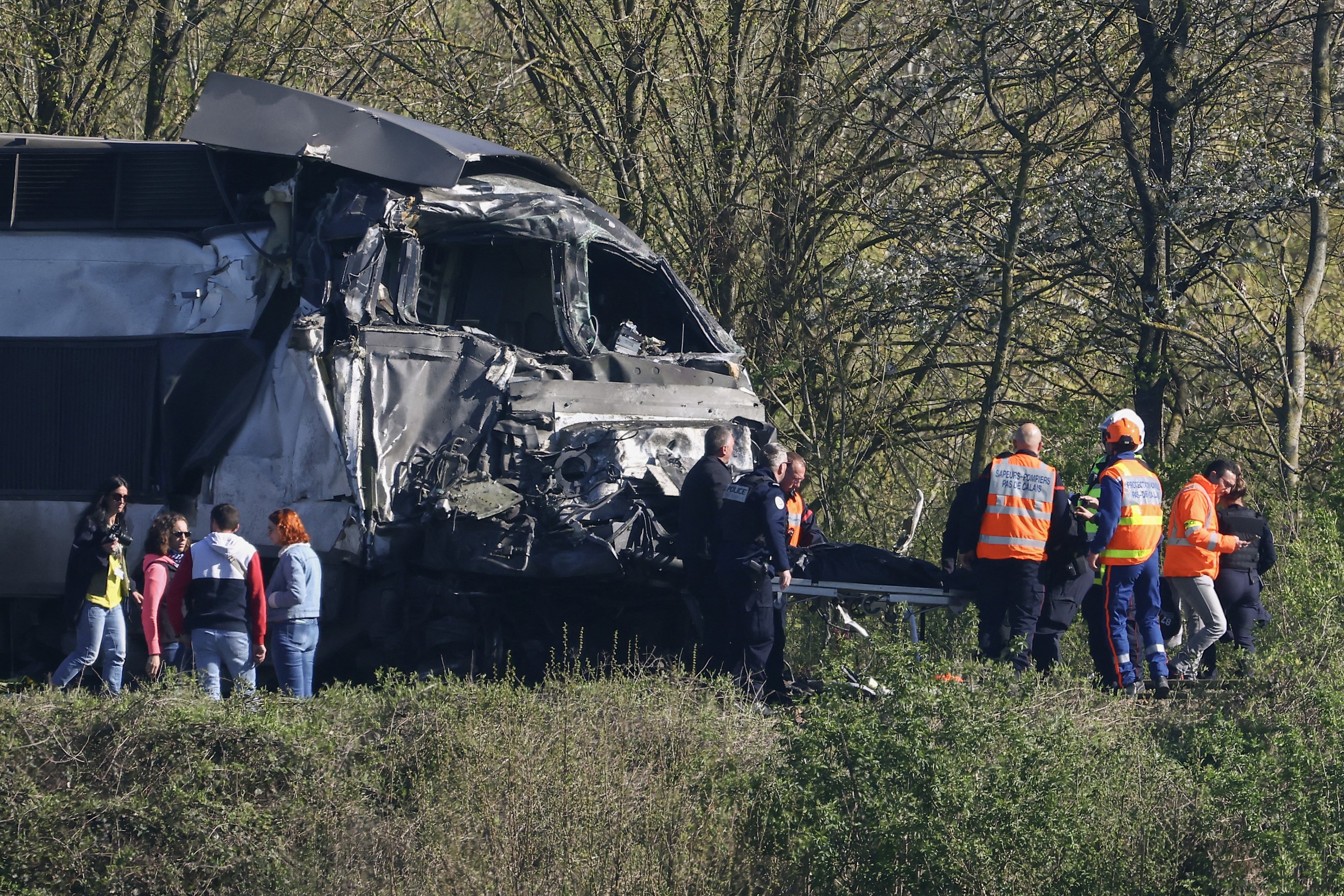 A French high-speed train crashed into a truck at a crossing in northern France on Tuesday, killing the driver of the TGV and critically injuring two people, officials said.